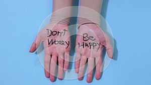 Don`t worry be happy concept on woman hands