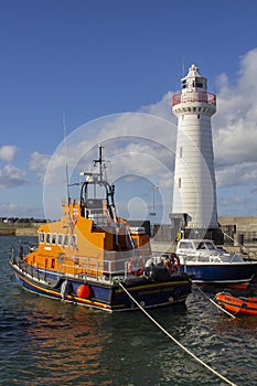 Donaghadee Lightouse and boats moored in Donaghadee Harbour