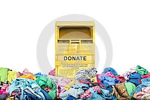 Donation box in a big pile of clothes