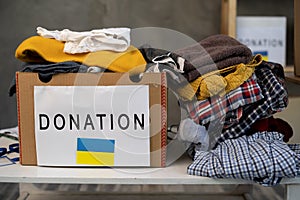 Donation box with clothes. boxes full with stuff for donate. Help poor. Cardboard box with clothes for charity. Donation