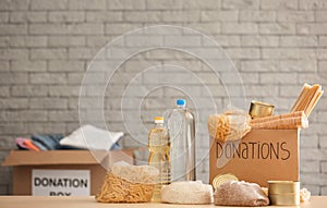 Donation box with food on table