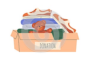 Donation box with kids toys, childrens clothes. Charity, humanitarian help, charitable voluntary aid for orphans