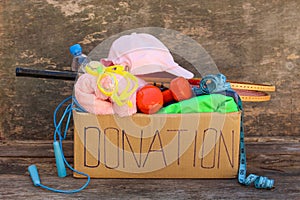 Donation box with sporting goods