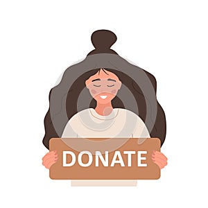Donation and charity concept. Volunteer woman holding in hands cardboard sign Donate. Support for homeless and poor