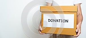 Donation, Charity, Volunteer, Giving and Delivery Concept. People donate Clothes and Food into Donation box at home or office for