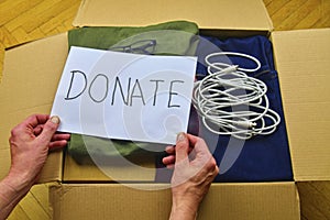 Donation concept. Donation box with donation clothes and accesories. Charity. Helping poor and needy people.