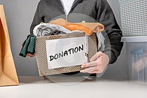 Donation concept. Donation box with donation clothes. Helping poor and needy people. Donation box for poor with clothing in male