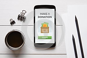 Donation concept on smart phone screen