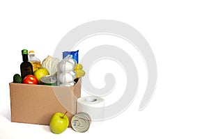Donation volunteer box with various products. Food set in a box on white background. Free space for text copy space