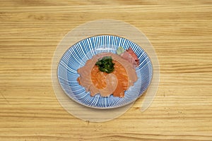 donburi, a Japanese dish consisting of a bowl of cooked rice topped with Norwegian salmon, ginseng and wasabi