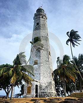 Dondra Head Lighthouse among the palm trees on the southernmost point in Sri Lanka, Devinuwara, Southern Province, Sri Lanka
