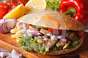 Doner kebab with meat and vegetables closeup. horizontal photo