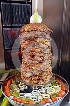 Doner kebab roasted on rotating spit photo