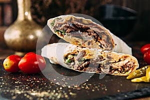 Doner kebab roll turkish dish with marinated meat photo