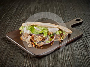 Doner kebab on wooden table