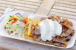 Doner meat with french fries and salad