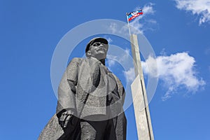 Donetsk, Ukraine - May 17, 2017: Monument to Vladimir Denin and the flag of Donetsk People`s Republic
