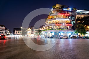 Dong Kinh Nghia Thuc Square in the Old Quarter of Hanoi, Vietnam at twilight. Street with copyspace and blurred buildings on