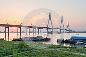 Dongting lake bridge with setting sun