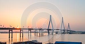Dongting lake bridge with setting sun
