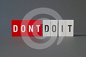 Dont do it - word concept on building blocks, text