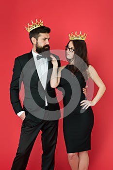 Dont go to prom alone. Prom king and queen. Sensual woman and bearded man wear prom crowns. Coronation party. Holiday