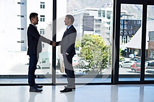 Dont just be the best - work alongside the best too. two businessmen shaking hands in an office.