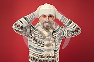 Dont let cold winter weather affect your style. Happy man in winter style red background. Mature man in casual comfy