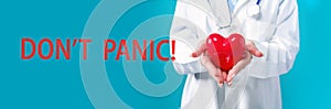 Dont Panic theme with a doctor holding a heart