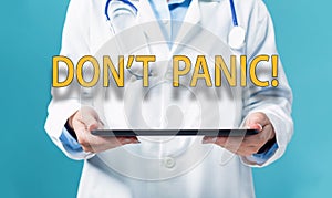 Dont Panic theme with a doctor using a tablet pc