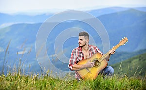 Dont Stop the Music. sexy man with guitar in checkered shirt. hipster fashion. western camping and hiking. happy and