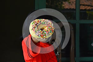 donut cake sprinkled with colorful mese photo