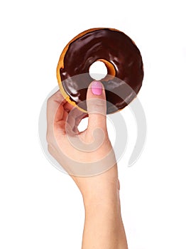 Donut with chocolate glazing in hand isolated