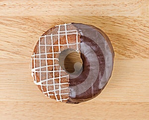 Donut chocolate glazing on wooden background, Assorted Colorful.