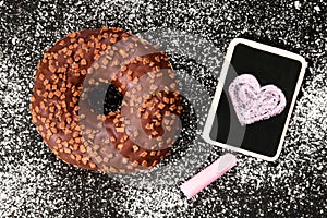 Donut with chocolate and heart drawing,