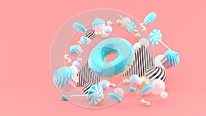 Donut ,Cupcakes ,Macaron,Candy floating among colorful balls on a pink background.-