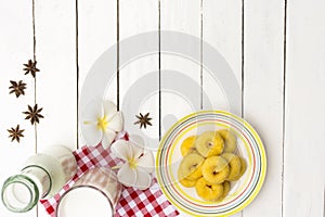 Donut dessert and milk bottle and milk glass on Red checkered fabric .Meal or breakfast hi-vitamin and calcium