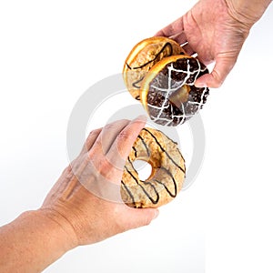 Donut or Donuts with hand on a background new