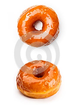 Donut glazed with caramel, isolated on white background. Top view and view from an angle of forty-five degrees