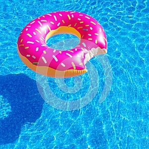 A donut inflatable raft in a swimming pool