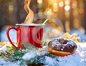 donut and mug in the snow