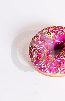 Donut pink on a white background with a sprinkler.