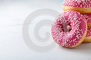 Donut. Sweet icing sugar food. Dessert colorful snack.Treat from delicious pastry breakfast. Bakery cake. Doughnut with frosting.