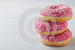 Donut. Sweet icing sugar food. Dessert colorful snack.Treat from delicious pastry breakfast. Bakery cake. Doughnut with frosting.