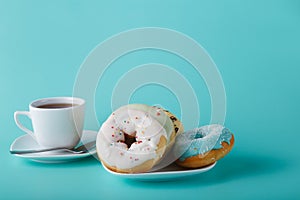 Donuts on aquamarine background