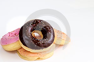 Donuts on white table background.