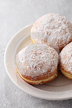 Donuts berlinera on a white plate