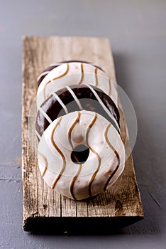 Donuts with Chocolate and Vanillas Icing on Wooden Tray on Gray Background Tasty Dinuts Morning Breakfast Coffee