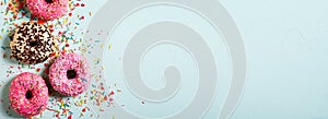 Donuts colorful background on blue, ceebration