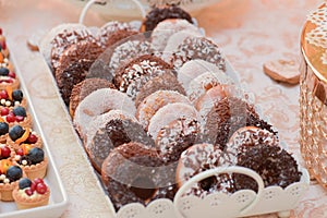 Donuts covered with white and brown chocolate